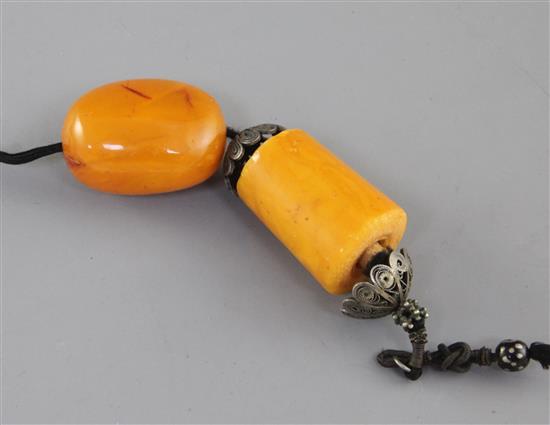 A Chinese silver filigree and amber pendant, late 19th century,